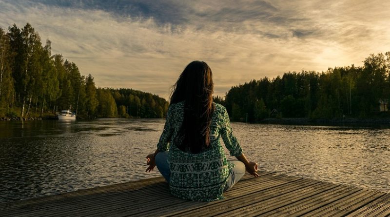 woman mindfulness and meditation on river